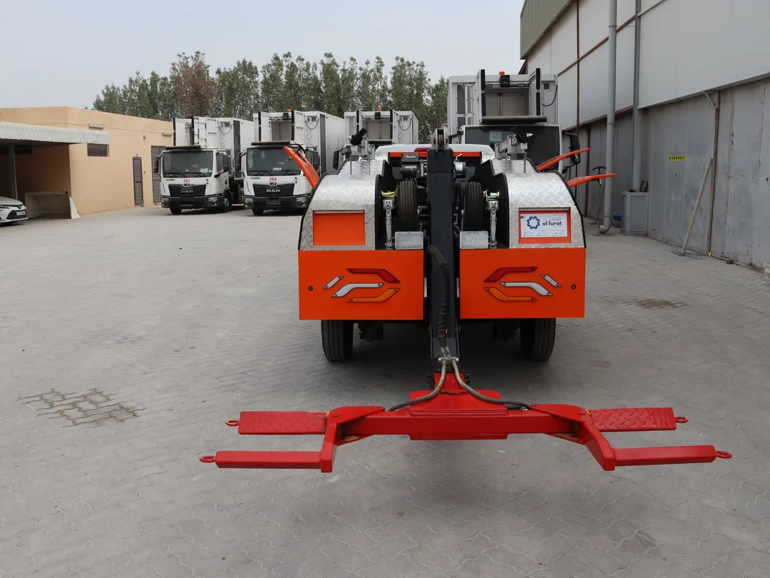 Direct rear view of the AQUILA 100 showing the fork device spread perpendicular to the vehicle being removed.