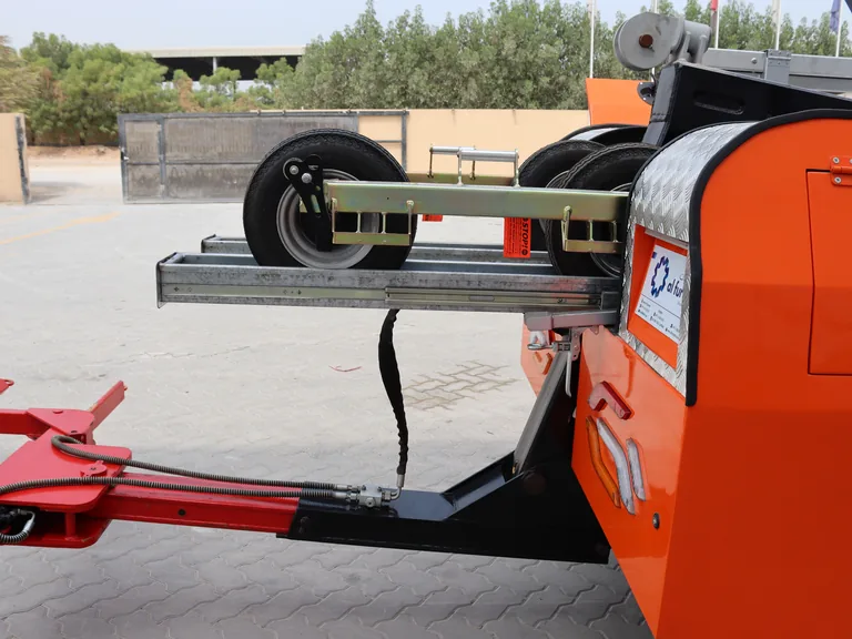 AQUILA 100 Z-arm with a wheel-retaining strap securing the load for removal.