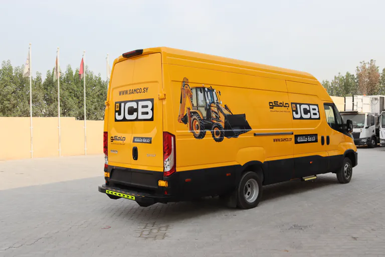 Rear three-quarter view of the mobile workshop van with rear doors closed