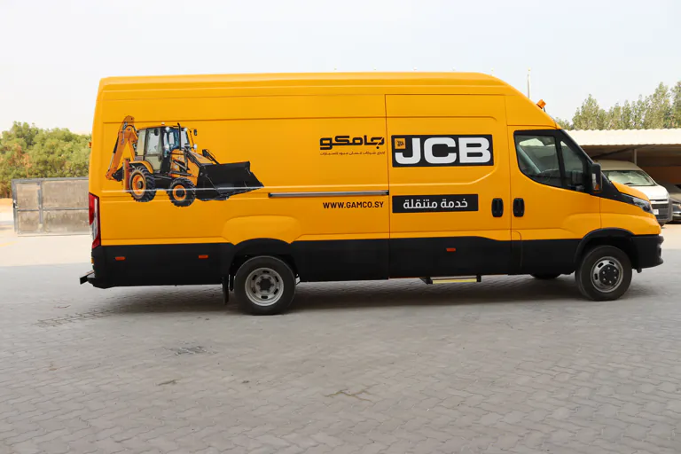 Full side profile of the completed yellow mobile workshop van